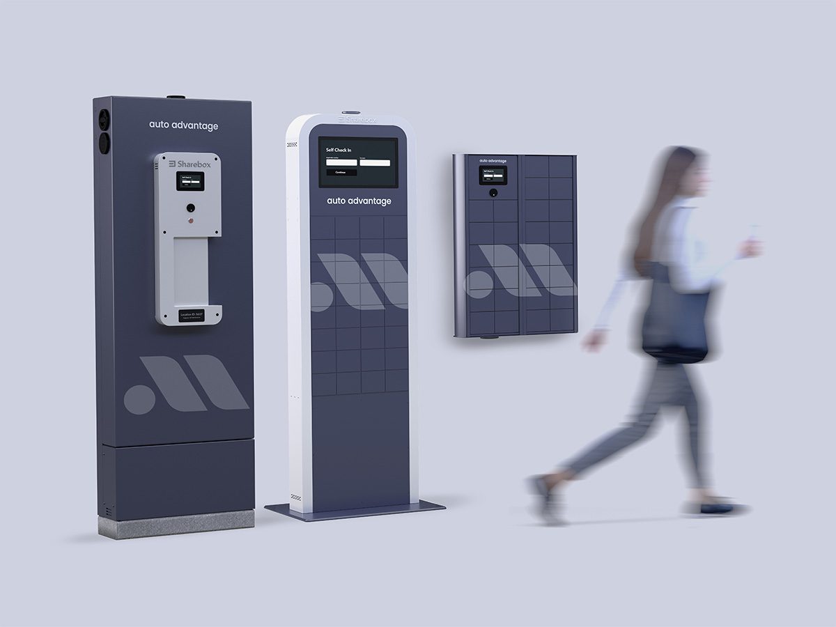 woman walking past custom branded Sharebox kiosks.